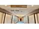 Hallway with high ceilings, carpet, and tile floor leading towards the entrance of Tower 2 at 135 E Harmon Ave # 2916, Las Vegas, NV 89109