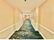Elegant hallway with patterned carpeting and neutral walls, leading to various rooms and amenities at 135 E Harmon Ave # 2916, Las Vegas, NV 89109