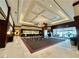Spacious lobby features elegant chandelier lighting, concierge services and views of the entrance at 135 E Harmon Ave # 2916, Las Vegas, NV 89109