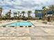 Community pool with lounge chairs and cabanas surrounded by palm trees, providing a relaxing resort-like atmosphere at 135 E Harmon Ave # 2916, Las Vegas, NV 89109