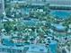 Stunning aerial view of a community pool surrounded by palm trees and lounge chairs, perfect for relaxation at 135 E Harmon Ave # 2916, Las Vegas, NV 89109
