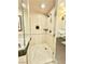 Tiled shower stall features a glass enclosure with multiple shower heads at 135 E Harmon Ave # 2916, Las Vegas, NV 89109