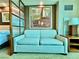 Comfortable sitting area has love seat with decorative art on the wall behind it at 135 E Harmon Ave # 2916, Las Vegas, NV 89109