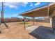 The back yard features a covered patio with a large, open space at 1437 Price St, Henderson, NV 89011