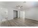 This bedroom features wood-style floors, a ceiling fan, a closet, and a bathroom at 1437 Price St, Henderson, NV 89011
