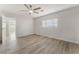 Clean bedroom featuring hardwood floors, modern ceiling fan, and a well-lit space at 1437 Price St, Henderson, NV 89011