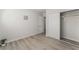 This bedroom features wood-style floors, a closet, and white paint at 1437 Price St, Henderson, NV 89011