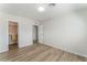 This bedroom features wood-style floors, a closet, and a modern ceiling light at 1437 Price St, Henderson, NV 89011