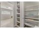 Hallway with organized shelving, linen closet, and easy access to other rooms at 1437 Price St, Henderson, NV 89011