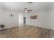 Spacious living room with hardwood floors, light walls and a decorative ceiling fan at 1437 Price St, Henderson, NV 89011