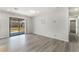 Cozy Living Room featuring a sliding glass door to the backyard and hallway access at 1437 Price St, Henderson, NV 89011