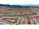 Community aerial view showing neighborhood streets, single-Gathering homes, a golf course and mountain views at 1803 Eagle Village Ave, Henderson, NV 89012