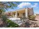 Inviting covered patio with lush landscaping, perfect for outdoor relaxation at 1803 Eagle Village Ave, Henderson, NV 89012