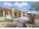 Charming covered patio with a view of the landscaped backyard at 1803 Eagle Village Ave, Henderson, NV 89012