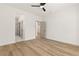 A secondary bedroom featuring wood-look floors and an en-suite bathroom at 1803 Eagle Village Ave, Henderson, NV 89012