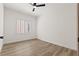 Bright bedroom with wood-look floors and window with plantation shutters at 1803 Eagle Village Ave, Henderson, NV 89012