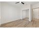 Bedroom with wood-look floors and mirrored closet doors at 1803 Eagle Village Ave, Henderson, NV 89012