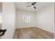 Bedroom with wood-look floors and plantation shutters on the window at 1803 Eagle Village Ave, Henderson, NV 89012
