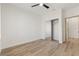 Bedroom with wood-look floors and mirrored closet doors at 1803 Eagle Village Ave, Henderson, NV 89012