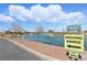 Scenic view of the driving range with a picturesque lake and fountain features at 1803 Eagle Village Ave, Henderson, NV 89012
