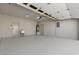 Spacious garage with epoxy flooring, utility sink, and plenty of room for storage at 1803 Eagle Village Ave, Henderson, NV 89012