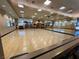 Spacious gym with hardwood floors, mirrored walls, and ample natural light at 1803 Eagle Village Ave, Henderson, NV 89012
