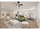Bright, open-concept living space with modern furnishings, seamlessly connecting the living, dining, and kitchen areas at 1803 Eagle Village Ave, Henderson, NV 89012