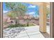 Relaxing patio with a view of the beautiful backyard and blue sky at 1803 Eagle Village Ave, Henderson, NV 89012