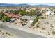 Aerial view of home displaying desert landscape, neighborhood, and distant mountains at 2040 Tucuman Ave, Pahrump, NV 89048