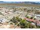 Aerial view of property and surrounding neighborhood with mountain backdrop at 2040 Tucuman Ave, Pahrump, NV 89048
