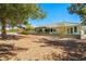 Expansive backyard with covered patio and well-maintained desert landscaping at 2040 Tucuman Ave, Pahrump, NV 89048