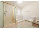 Bright bathroom with a glass-enclosed shower, toilet, and tile flooring in a clean, functional layout at 2040 Tucuman Ave, Pahrump, NV 89048