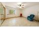 Bedroom featuring an oversized window, ceiling fan, and mirrored closet doors at 2040 Tucuman Ave, Pahrump, NV 89048