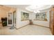 Open dining area featuring tile floors, natural light, and access to the living area at 2040 Tucuman Ave, Pahrump, NV 89048