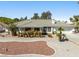 Charming single-story home featuring desert landscaping and a neutral color palette exterior at 2040 Tucuman Ave, Pahrump, NV 89048