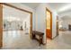 Spacious hallway featuring tile flooring and an open doorway with a view of a bright and airy living room at 2040 Tucuman Ave, Pahrump, NV 89048