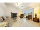 Cozy living room with a stone fireplace, comfortable seating, and a large window at 2040 Tucuman Ave, Pahrump, NV 89048