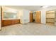 Spacious main bathroom with double sinks and tile flooring, leading to closet and water closet at 2040 Tucuman Ave, Pahrump, NV 89048
