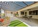 Spacious covered patio with a dining area and lattice shading, perfect for enjoying the outdoors at 2040 Tucuman Ave, Pahrump, NV 89048