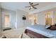 Bedroom features carpet, ceiling fan, and access to the bathroom and back patio at 2116 Burtonsville Dr, Henderson, NV 89044