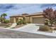 Beautiful desert home featuring mature landscaping, tile roofing and a two car garage at 2116 Burtonsville Dr, Henderson, NV 89044