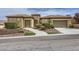 Charming single-story home features a tile roof, desert landscape and two-car garage at 2116 Burtonsville Dr, Henderson, NV 89044