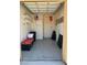 Functional garage with shelving and speckled epoxy flooring for organized storage and easy maintenance at 2116 Burtonsville Dr, Henderson, NV 89044