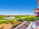 Scenic golf course view with lush green fairways, a tranquil lake, and distant mountain vistas at 2116 Burtonsville Dr, Henderson, NV 89044