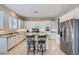 Modern kitchen with stainless appliances, granite countertops, and white cabinets at 2116 Burtonsville Dr, Henderson, NV 89044