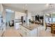 Open kitchen with center island, stainless appliances and access to Gathering and dining areas at 2116 Burtonsville Dr, Henderson, NV 89044