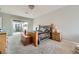 Comfortable bedroom featuring plush carpet, slider to patio, and ample natural light at 2116 Burtonsville Dr, Henderson, NV 89044