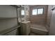 Compact bathroom with a tiled shower-tub combo and essential fixtures at 2125 Flower Ave, North Las Vegas, NV 89030