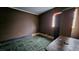 Simple bedroom featuring unique flooring and a cozy atmosphere at 2125 Flower Ave, North Las Vegas, NV 89030