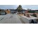 Modest single-story home featuring a covered porch and spacious front yard at 2125 Flower Ave, North Las Vegas, NV 89030